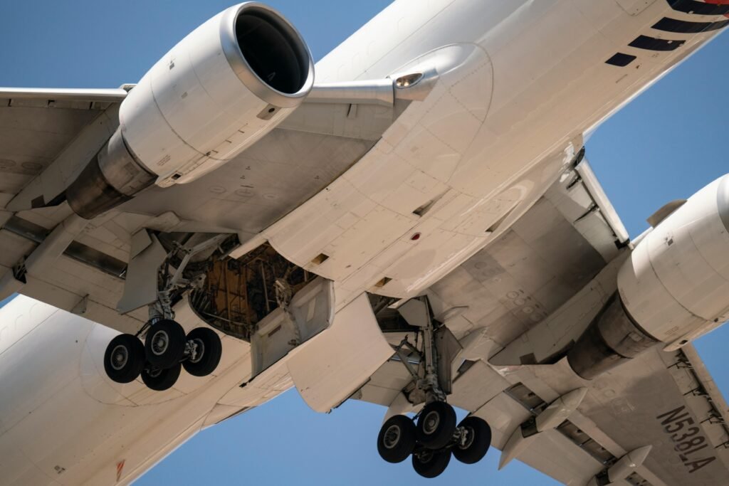 Detailed view of airplane undercarriage during takeoff at Santiago, Chile airport.